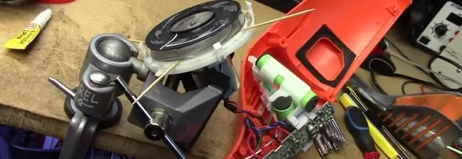 Vacuum cleaner repair parts and tools on a workbench in Myrtle Beach, SC